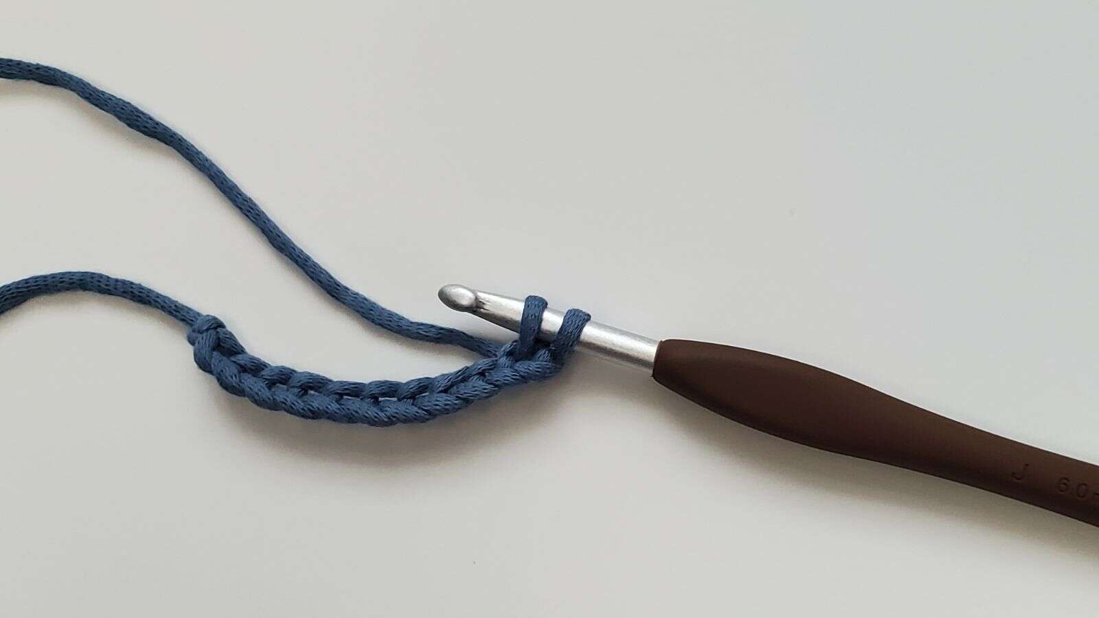 Extended single crochet stitch with two loops on crochet hook