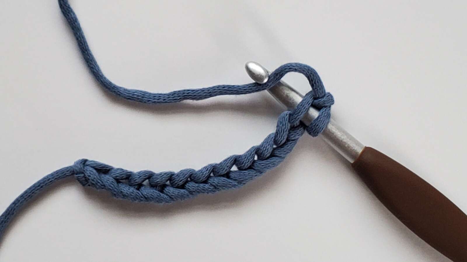 Linked half double crochet step 2, inserting hook into 2nd chain from hook and yarn over