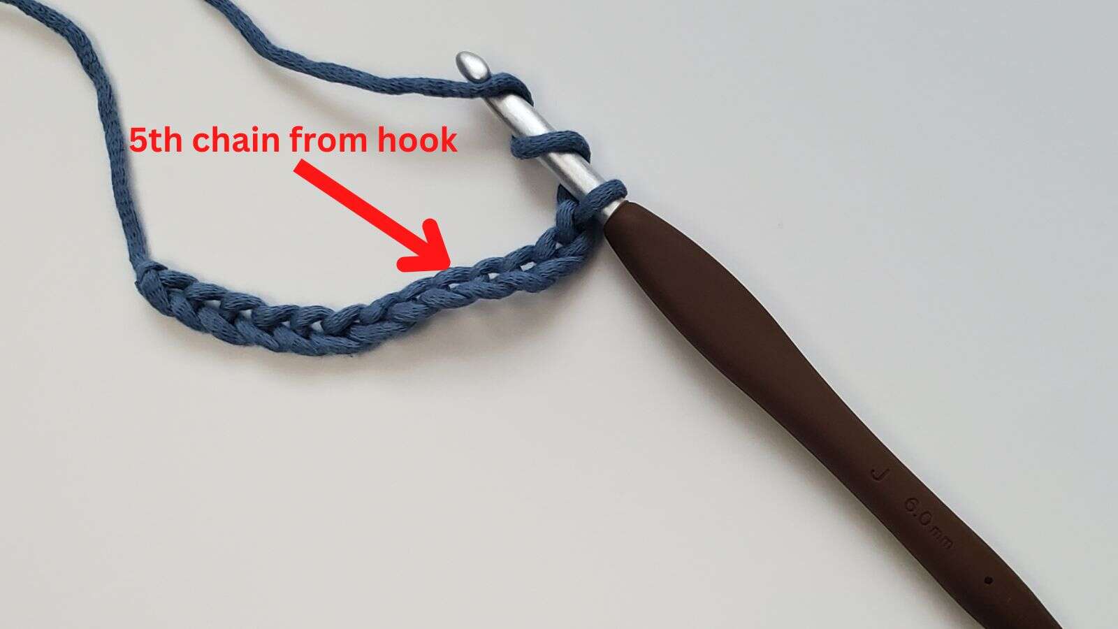 Arrow showing 5th chain from hook in the foundation chain