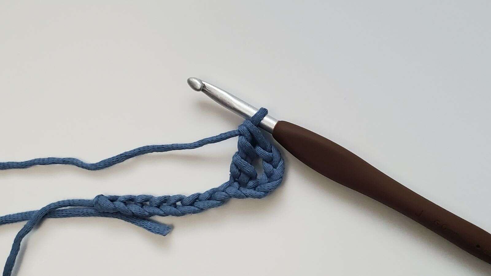 A completed triple crochet stitch on a foundation chain