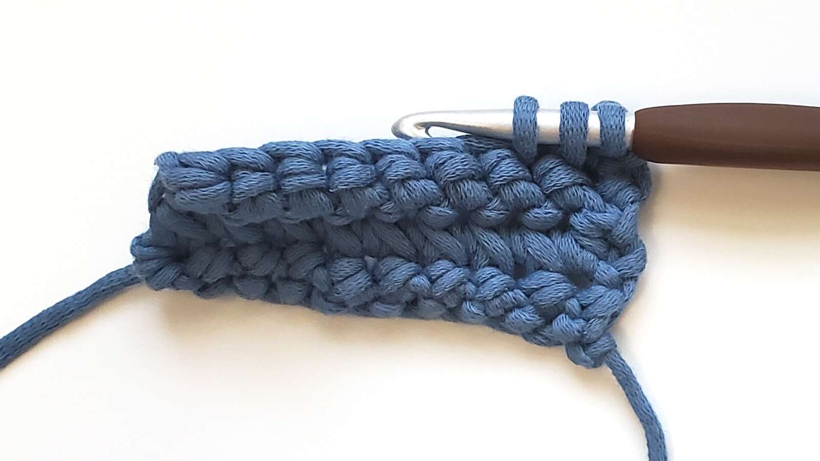 3 loops on the hook when creating a paired single crochet
