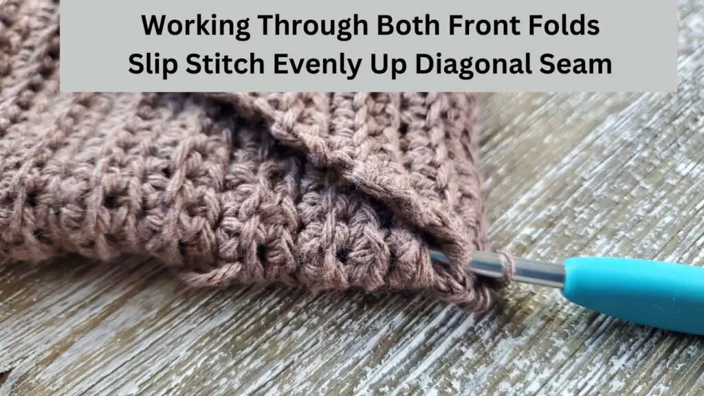 Slip Stitch Evenly up seam working through the 2 top folds to connect them together